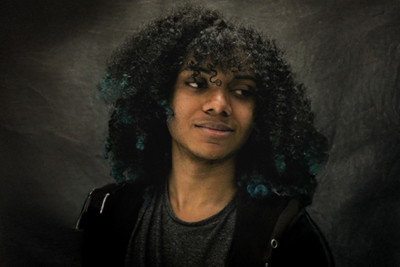 Kaleem smiling in studio